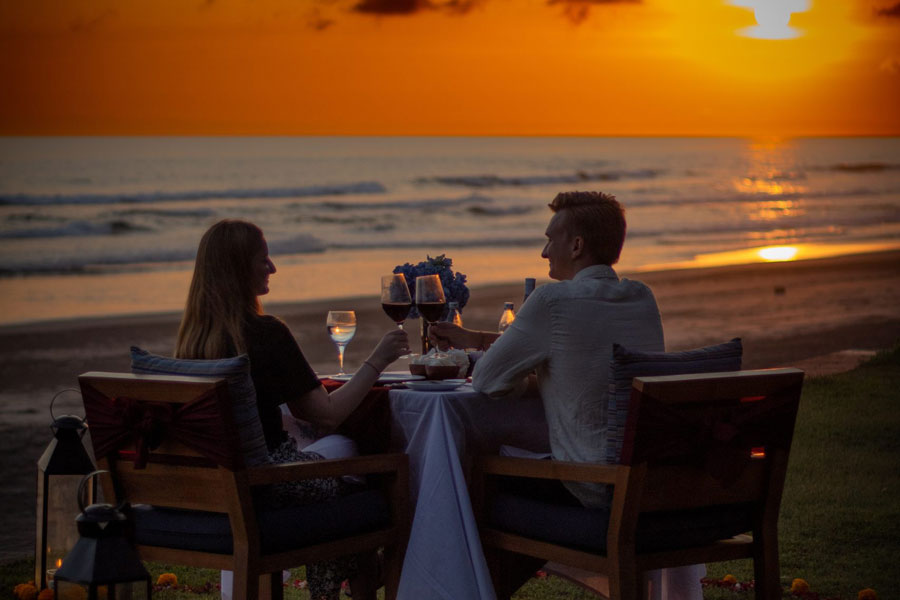 Romantic candlelit dinner set-up for two as part of the Bali honeymoon package at Kelapa Retreat and Spa